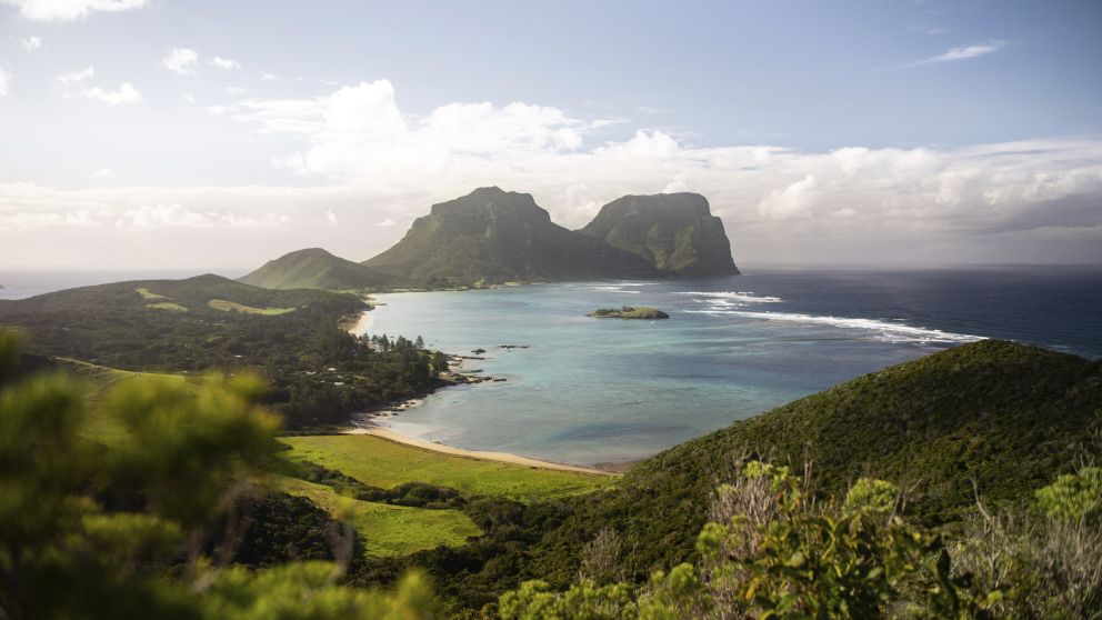 Scenic coastal views across Lord Howe Island to Mount Lidgbird and Mount Gower - Credit: tom-archer.com