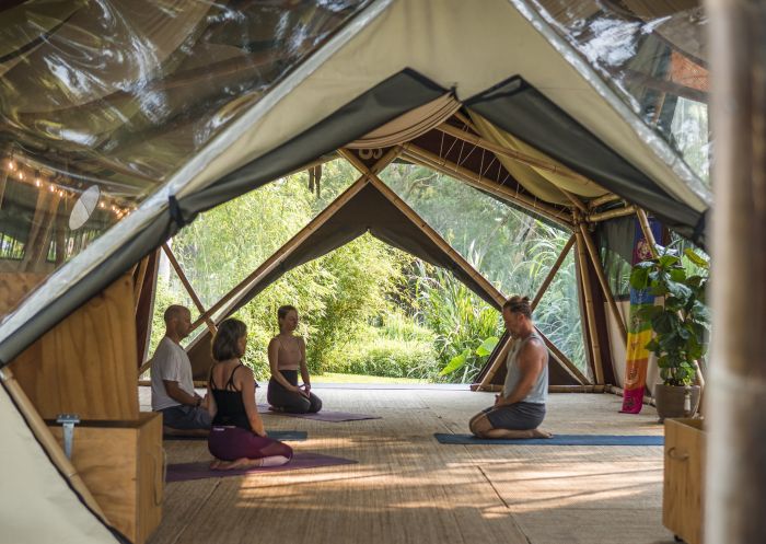 Students practicing yoga at Bamboo Yoga School, Byron Bay