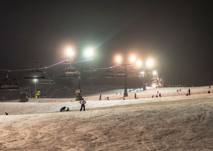 Skiing at night in Perisher, Kosciuszko National Park, Snowy Mountains 